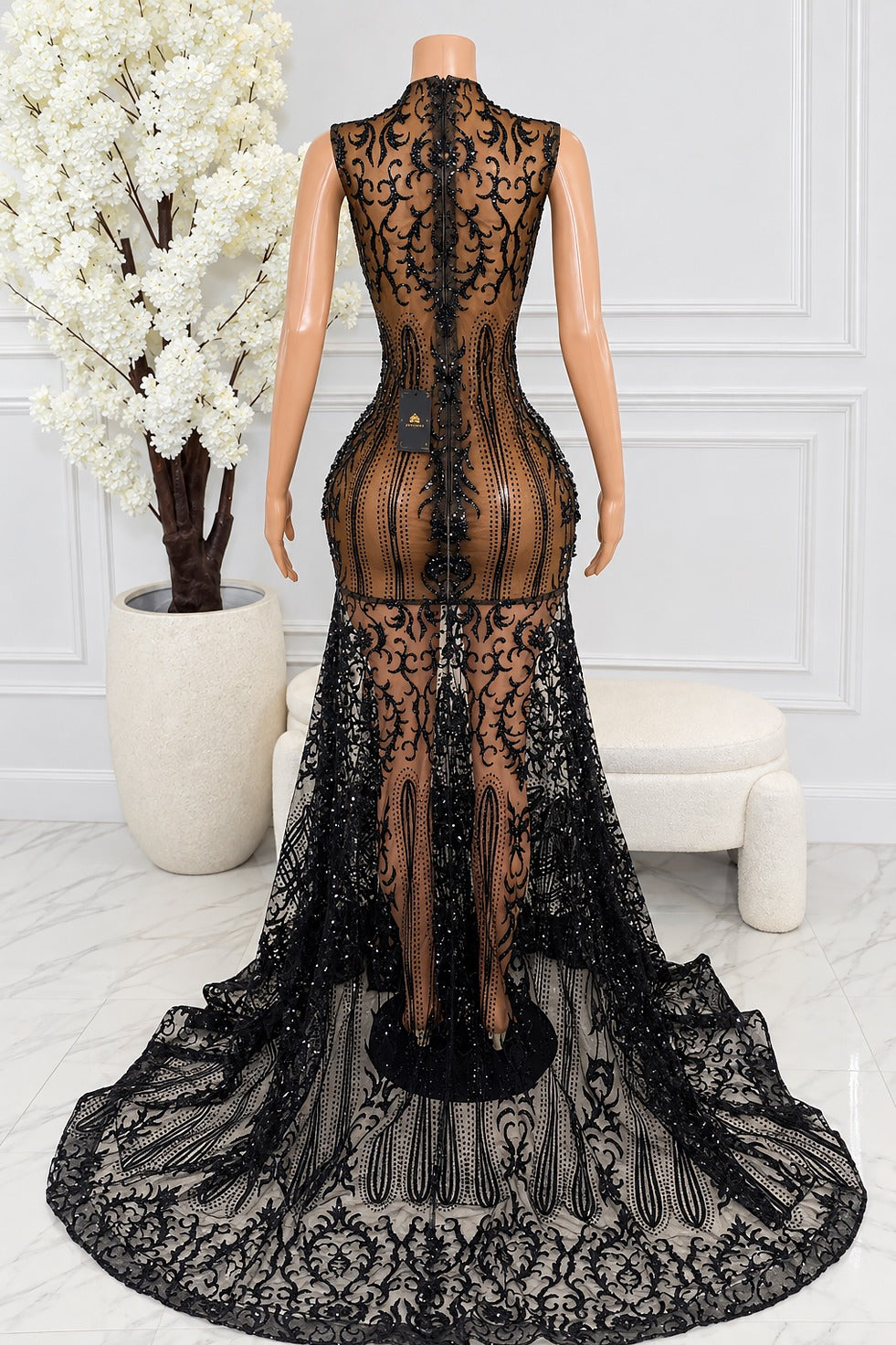 Back view of Colette black sheer embroidered lace maxi dress with fitted silhouette and sweeping train
