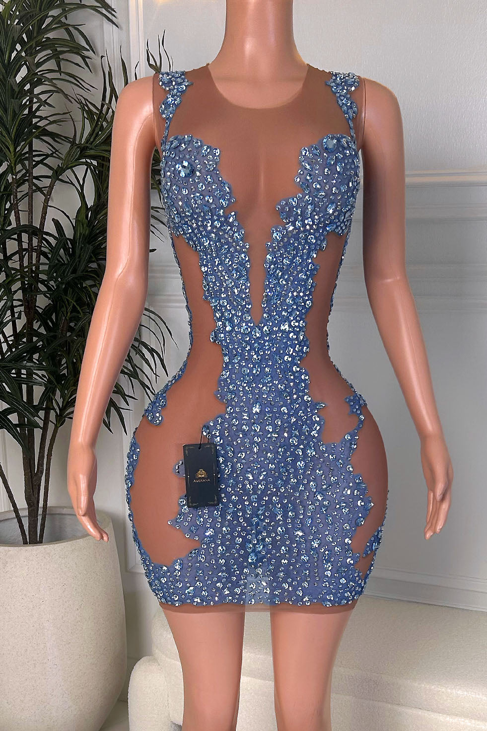 Blue rhinestone embellished sheer nude mesh cutout mini dress with illusion plunge neckline, front view on mannequin