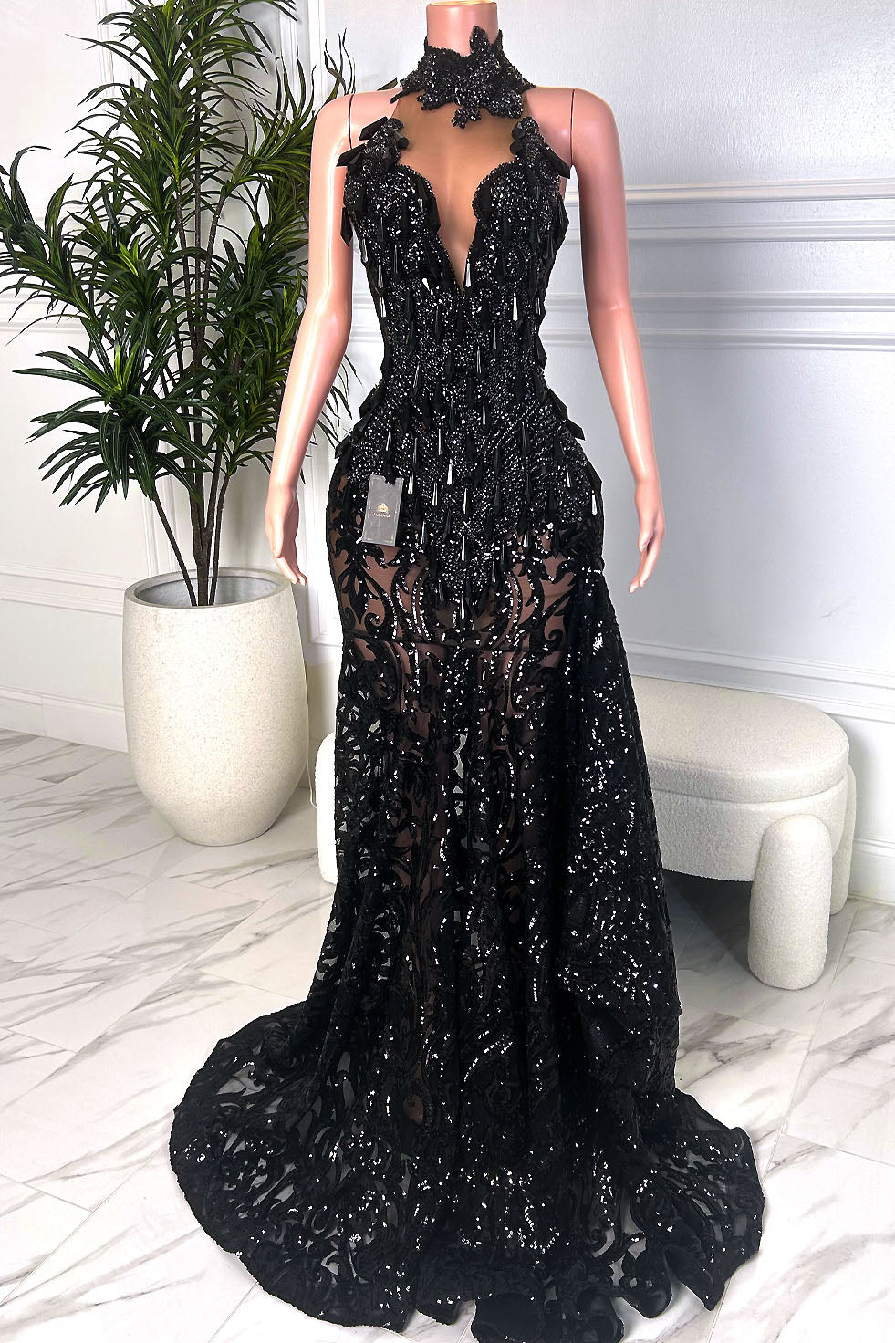 Black sequin lace halter mermaid gown with plunging neckline, high collar, and dramatic floor-length train