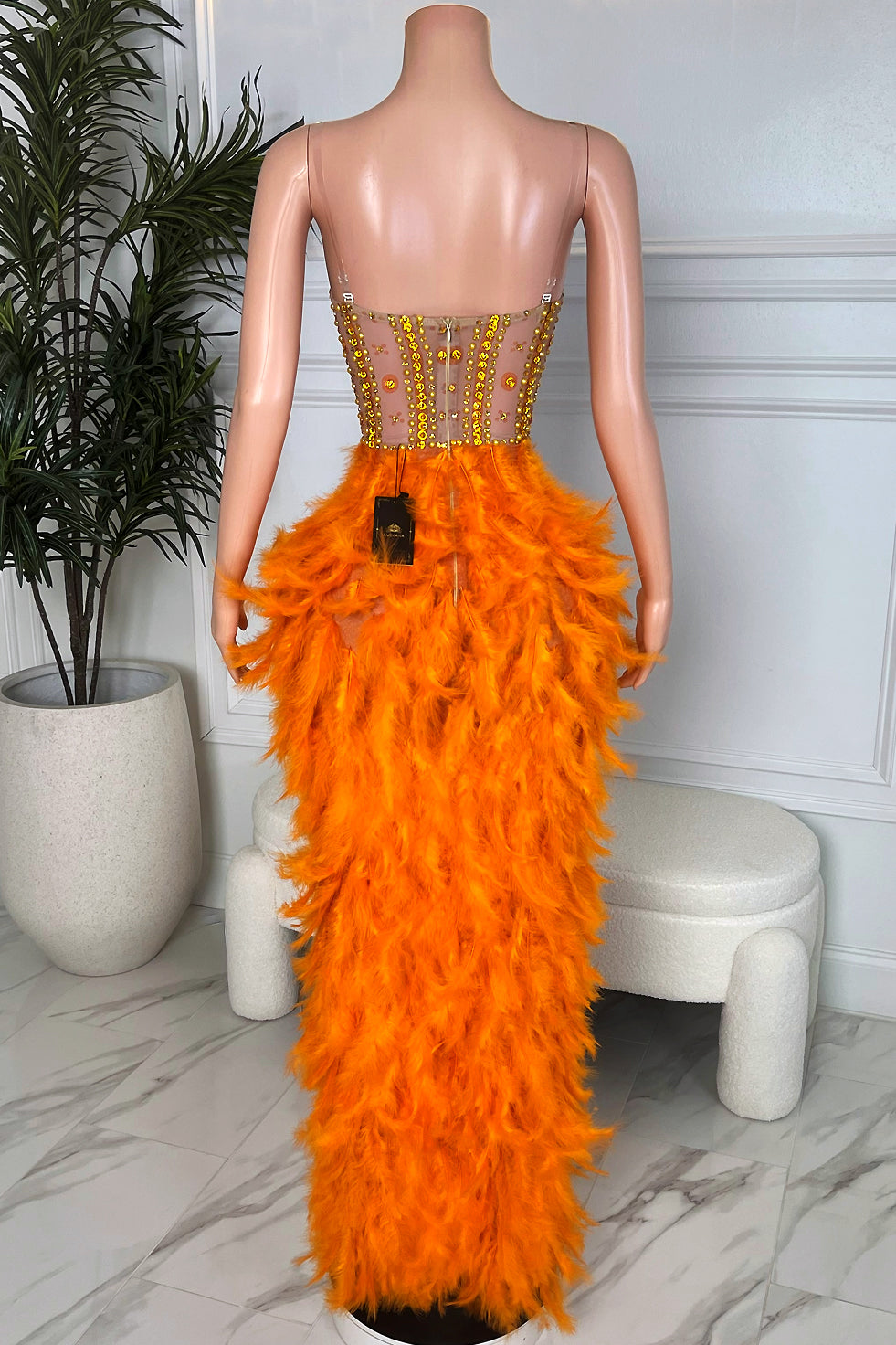 Amekana Solar Siren Feather Gown, orange feather maxi dress with sheer embellished back and full feather skirt, back view on mannequin.