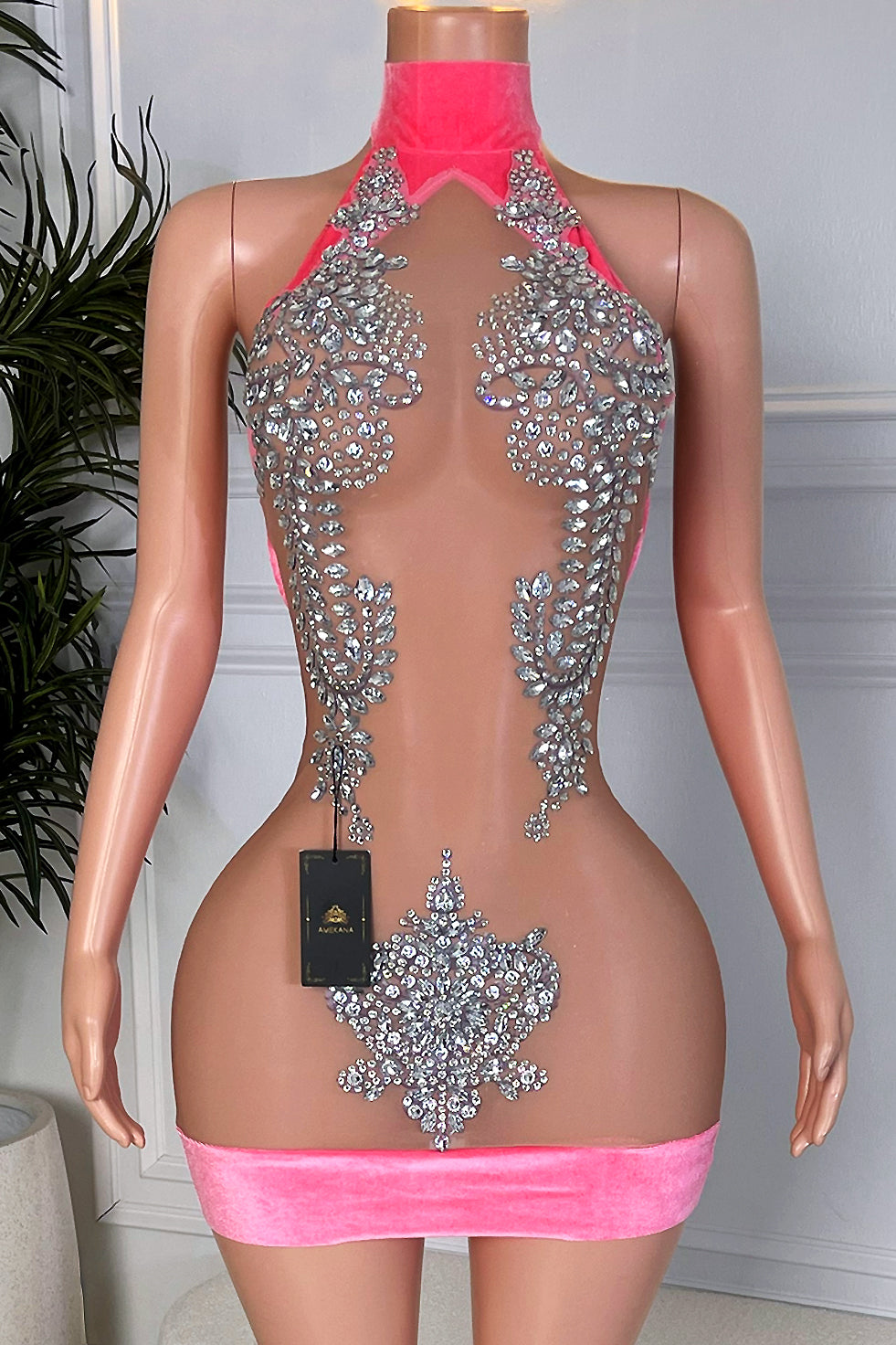 Hot pink velvet halter illusion mesh mini dress with silver rhinestone applique front view on mannequin