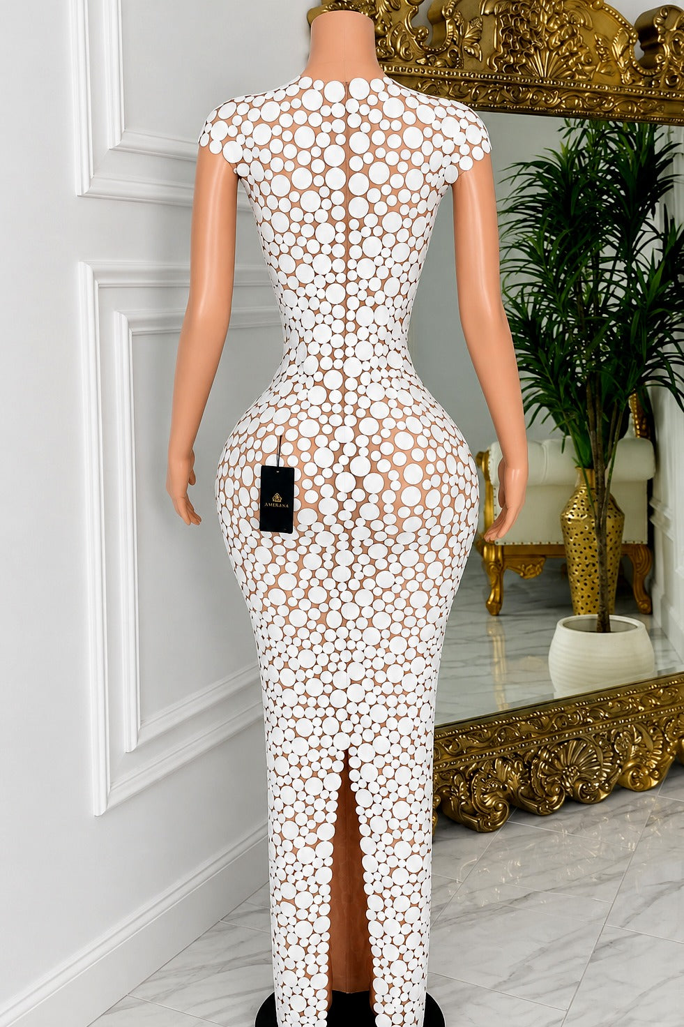 Back view of Elvaira White Circle Appliqué Maxi Dress showing white circular appliqués and a center-back slit.