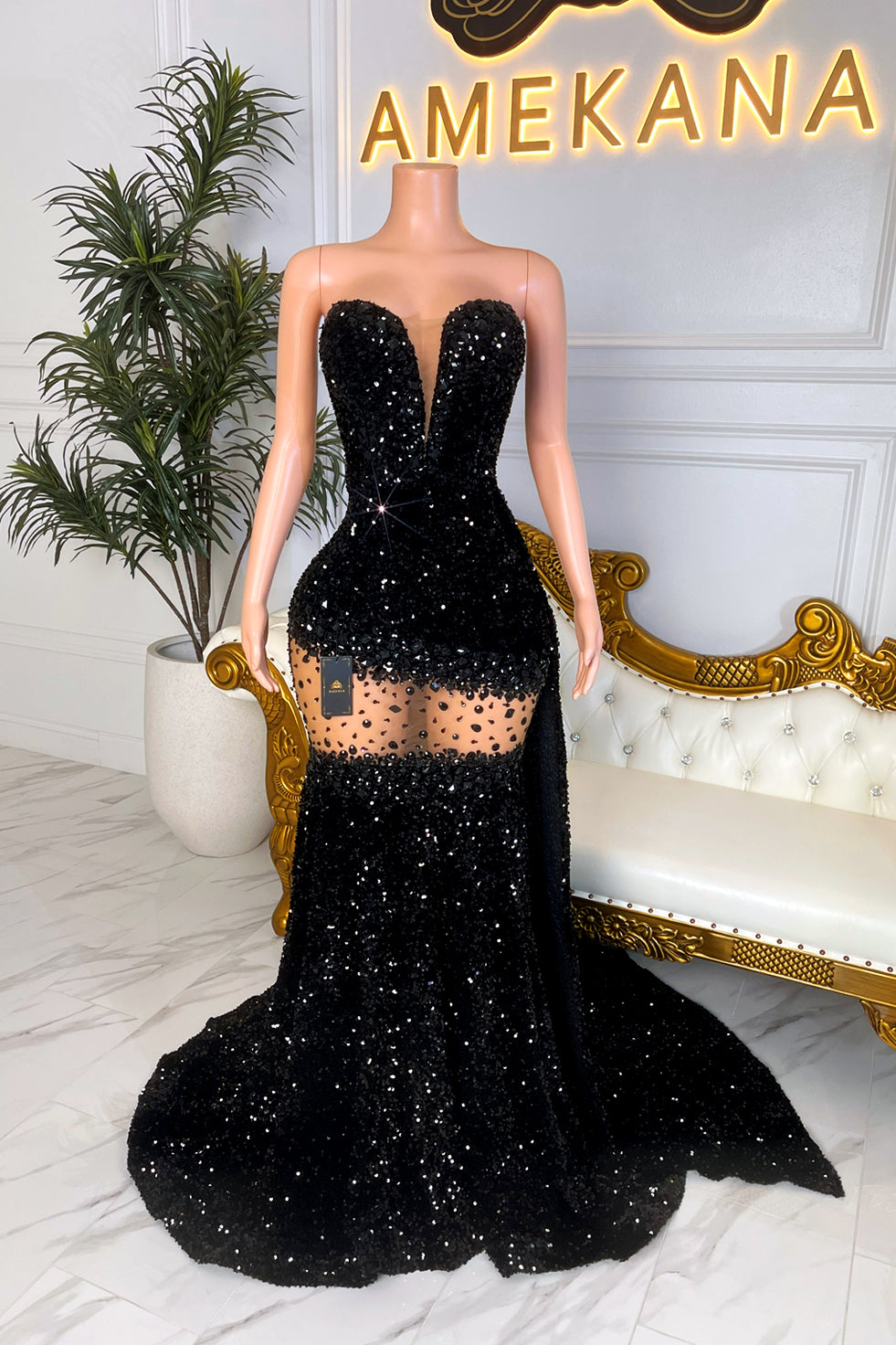Sparkly black mermaid evening dress with fitted bodice and dramatic train