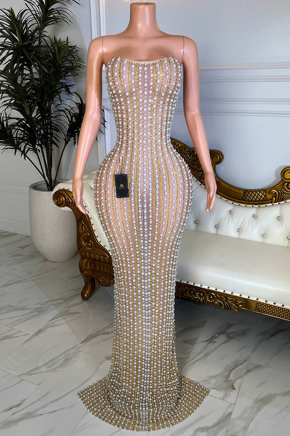 Strapless white pearl and gold rhinestone bodycon maxi dress with nude illusion base and fitted silhouette, front view.