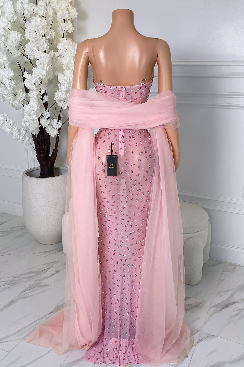 Back view of pink rhinestone dress styled with matching sheer pink shawl