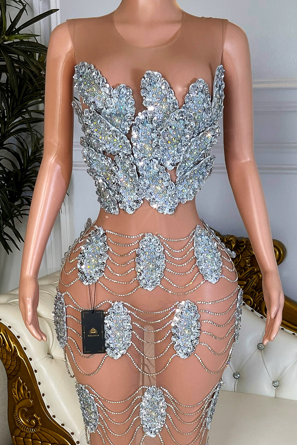 Close up of nude mesh bodice covered in overlapping silver crystal leaf appliqués on Celestial Medallion Maxi Dress.