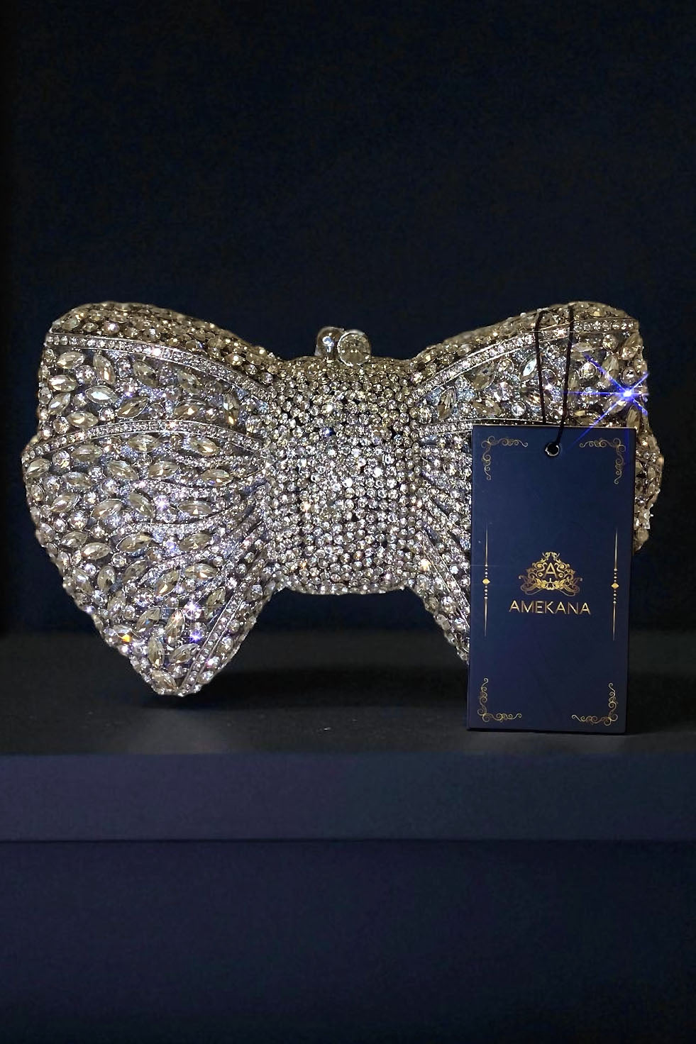 Silver bow shaped rhinestone clutch bag with high shine crystals from Amekana