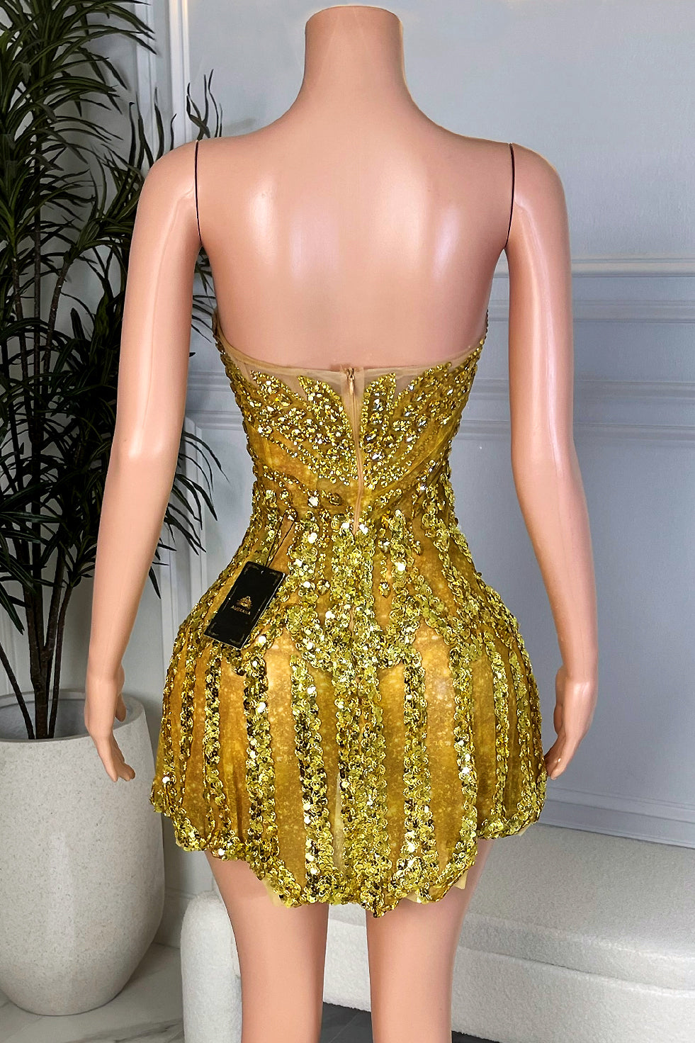 Back view of sparkly gold rhinestone corset mini dress with exposed zipper and fitted bubble skirt, Amekana gold sequin party mini dress