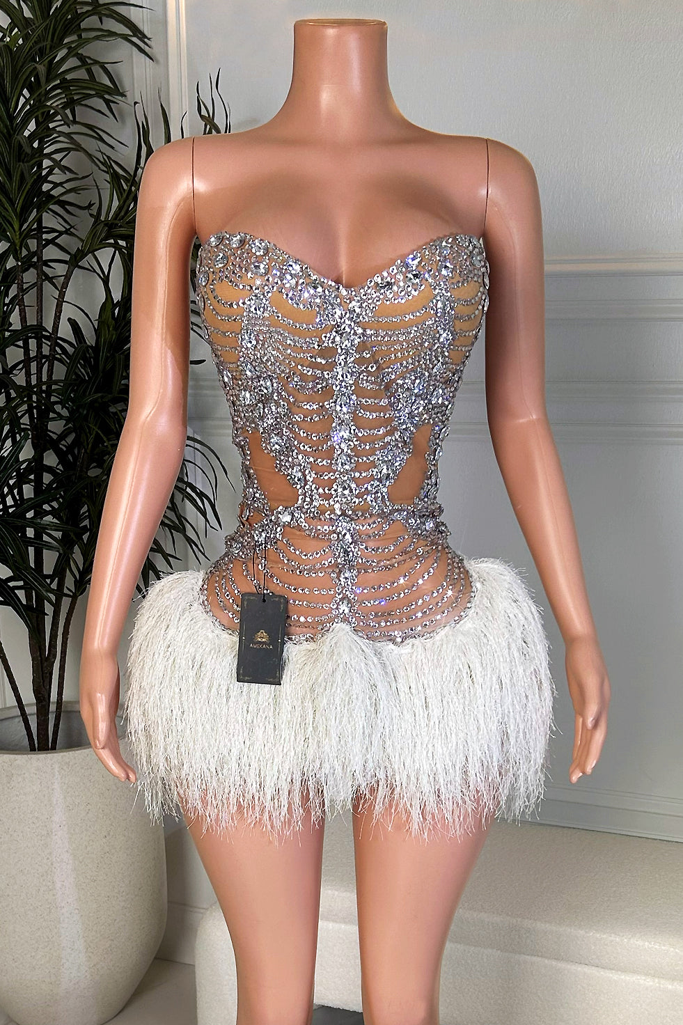 Pink nude illusion rhinestone maxi dress with one-shoulder ruffle detail and sheer bodycon silhouette, front view by Amekana.